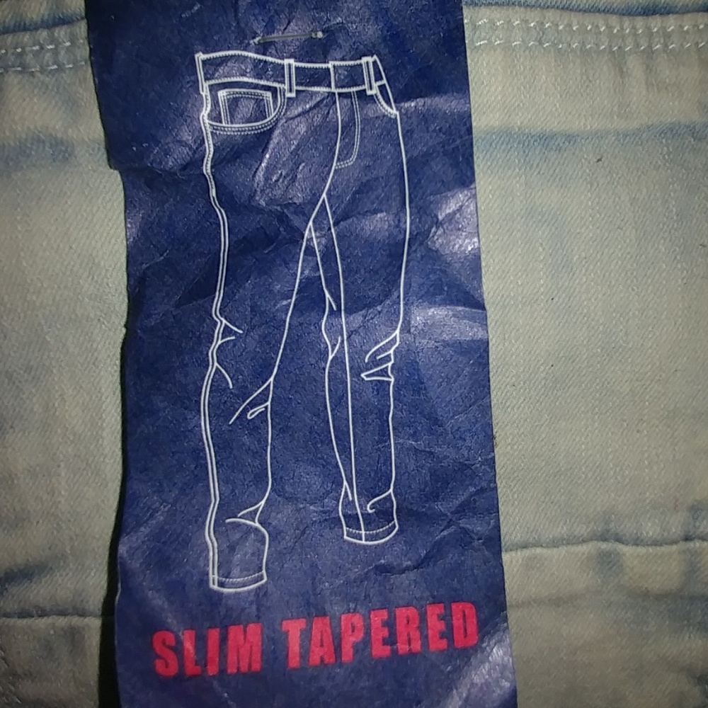 NWT light acid wash distressed look jeans.